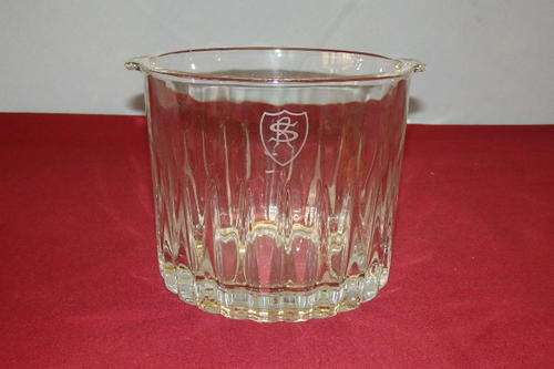 AN EXQUISITE CRYSTAL DOUBLE HANDLE ICE BUCKET WITH AN ETCHED MONOGRAM ON THE SIDE