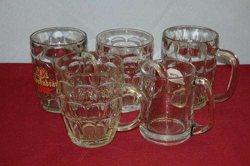A WONDERFUL COLLECTION OF FIVE MIXED GLASS BEER TANKARDS INCLUDING BRANDED TANKARDS