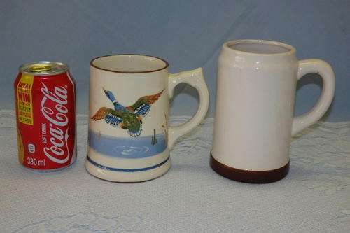 TWO WONDERFUL OLD VINTAGE PORCELAIN BEER TANKARDS INCLUDING ONE WITH A GROUSE/DUCK DECAL bid/tankard