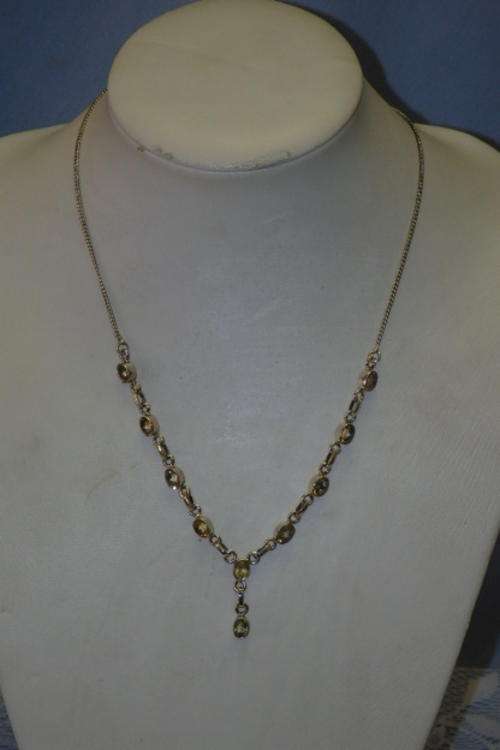 A BEAUTIFUL STERLING SILVER LADIES NECKLACE WITH A SERIES OF 10 INCREDIBLE OVAL CITRINE STONES
