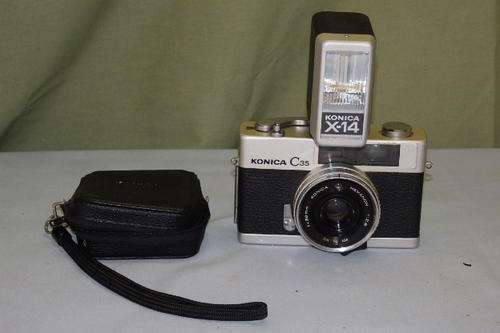 A FANTASIC VINTAGE (c1970's) KONICA C35 35mm CAMERA WITH A KONICA X-14 FLASH IN AWESOME CONDITION