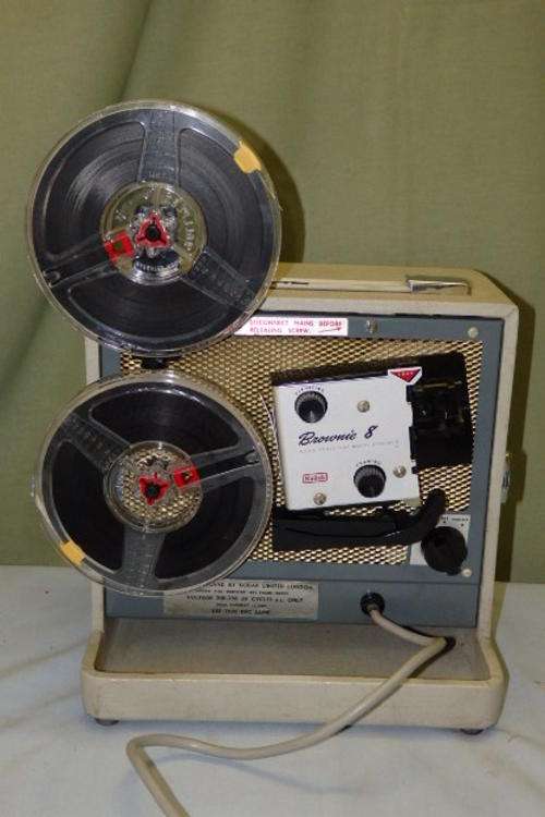 AN AWESOME KODAK BROWNIE "8" 8mm MODEL A15G MOVIE PROJECTOR WITH TWO FILMS IN WORKING CONDITION