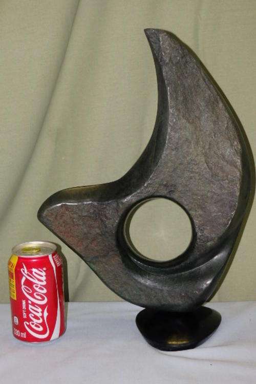 AN INCREDIBLE SIGNED CARVED STONE SCULPTURE BY ZIMBABWEAN ARTIST "PETER GONDO" TITLE "THE ROSE"