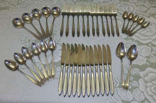 AN AWESOME STAINLESS STEEL "EETRITE" CUTLERY SERVICE IN THE BEAUTIFUL "ELITE" PATTERN