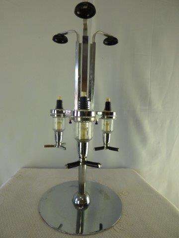 A LOVELY METAL 3 BOTTLE REVOLVING OPTIC FOR THE PUB OR LAPA.