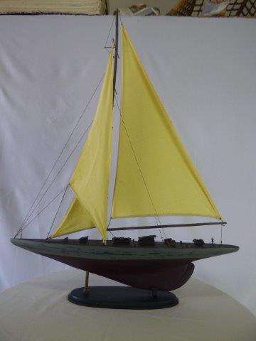A BEAUTIFULLY DETAILED WOODEN MODEL OF A SAIL YACHT. BEAUTIFUL ON DISPLAY!!