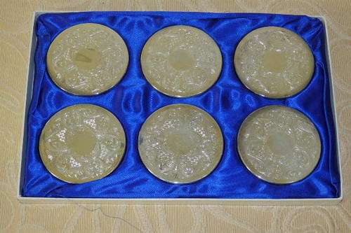 A BEAUTIFUL BOXED SET OF SIX SILVER PLATED ORNATE CHAMPAGNE GLASS COASTERS; IDEAL FOR A BRIDES TABLE