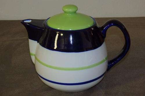 A BEAUTIFUL GREEN AND BLUE HAND PAINTED "WOOLWORTHS" FOUR CUP TEAPOT IN MINT CONDITION