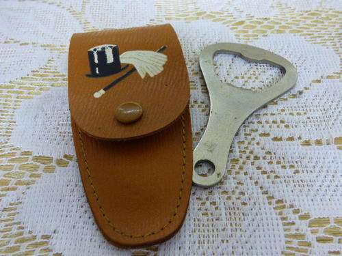 A FABULOUS MADE IN ENGLAND BOTTLE OPENER IN A LEATHER POUCH  = IDEAL FOR IN THE PUB, LAPA ETC!!