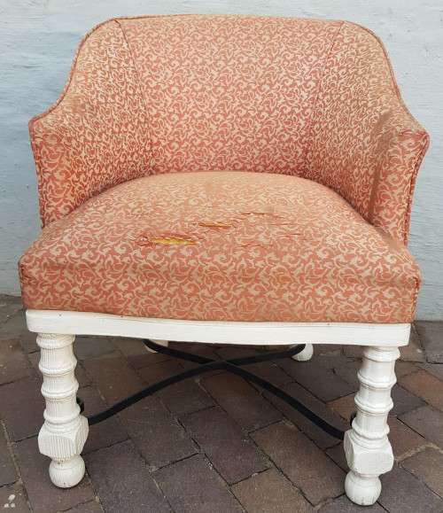 A stylish wrought iron and wood base armchair for restoration