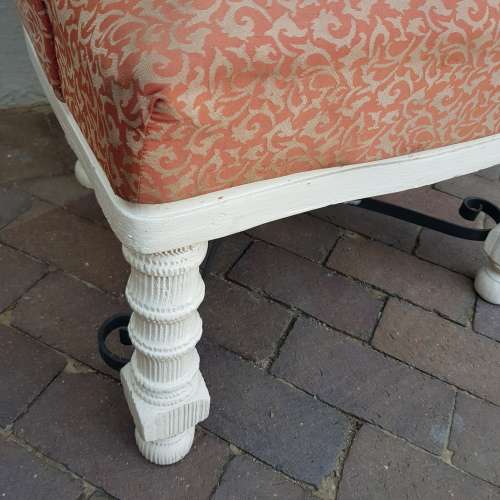 A stylish wrought iron and wood base armchair for restoration