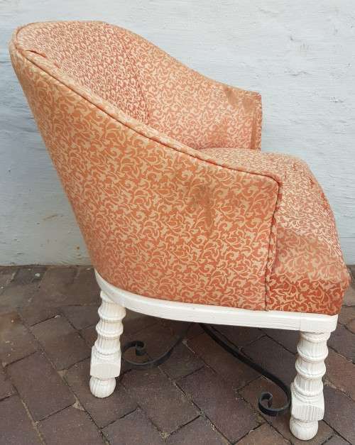 A stylish wrought iron and wood base armchair for restoration