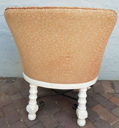 A stylish wrought iron and wood base armchair for restoration
