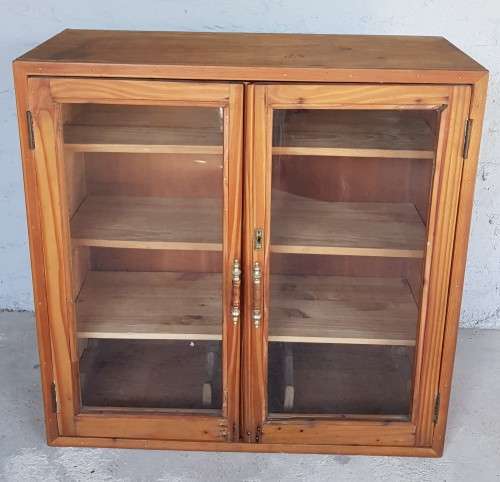 A solid Oregon pine cabinet with glass doors and wood shelves. Stunning in any home!!