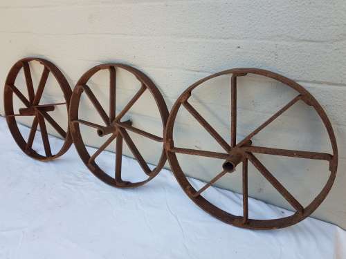 An amazing set of antique 8-spoke steel wagon/ carriage/ cart wheels (1 bid for all 3 wheels)
