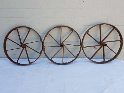 An amazing set of antique 8-spoke steel wagon/ carriage/ cart wheels (1 bid for all 3 wheels)