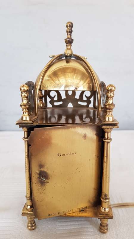 A vintage art deco brass Genelex electric clock