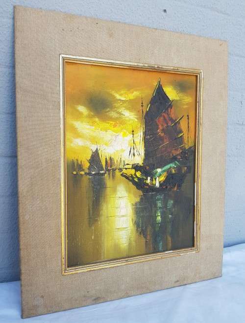 A beautiful painting of boats at sunset
