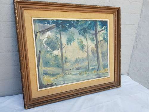 A beautiful framed oil painting of a forrest scene