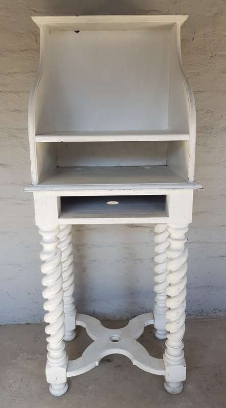 A painted white podium, solid timber