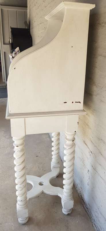 A painted white podium, solid timber
