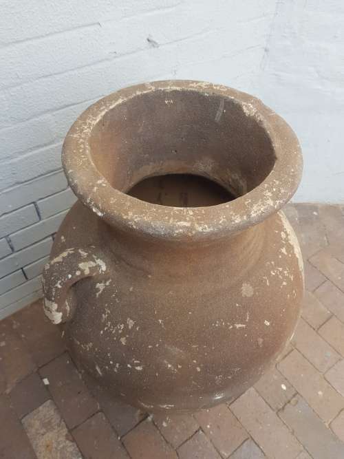 A large concrete free standing outdoor vase. Stunning in a garden!