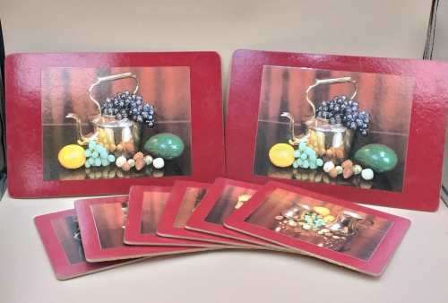 A beautiful set of eight cork base table place mats including two larger serving mats and six place