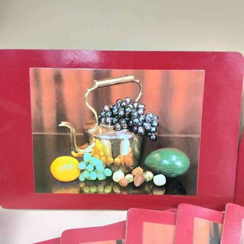 A beautiful set of eight cork base table place mats including two larger serving mats and six place