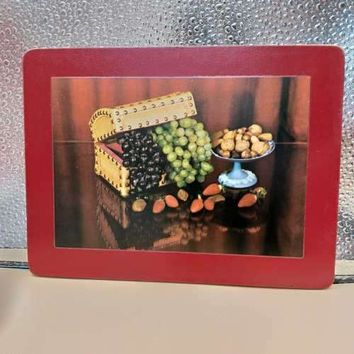 A beautiful set of eight cork base table place mats including two larger serving mats and six place