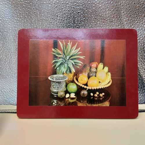 A beautiful set of eight cork base table place mats including two larger serving mats and six place
