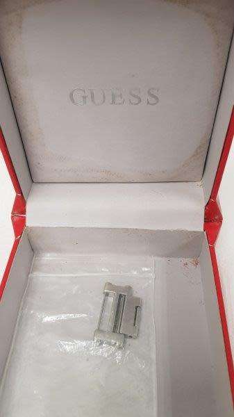 A stunning `GUESS` ladies wrist watch with with a broad strap