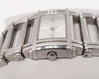 A stunning `GUESS` ladies wrist watch with with a broad strap