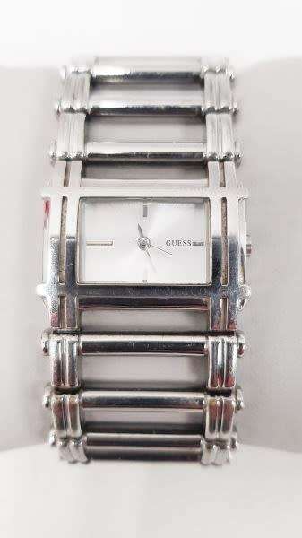 A stunning `GUESS` ladies wrist watch with with a broad strap