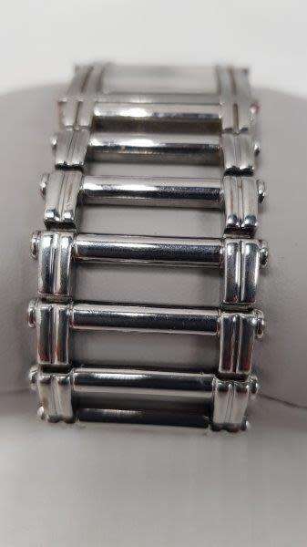 A stunning `GUESS` ladies wrist watch with with a broad strap