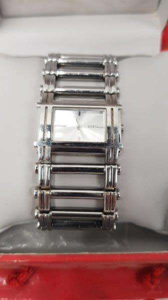 A stunning `GUESS` ladies wrist watch with with a broad strap