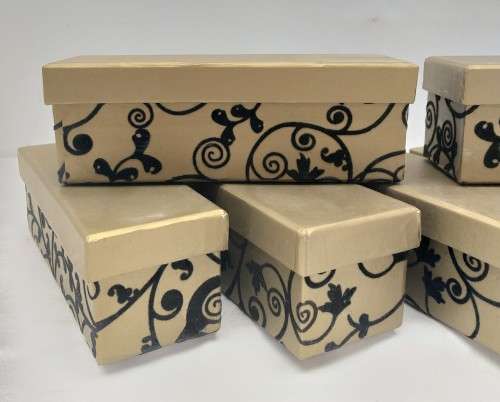 A lovely collection of 7x gold lidded boxes with black velvet brocade pattern detailing