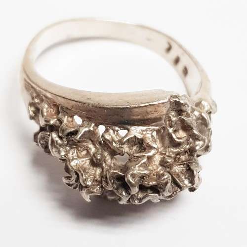Three pretty stamped silver ladies rings