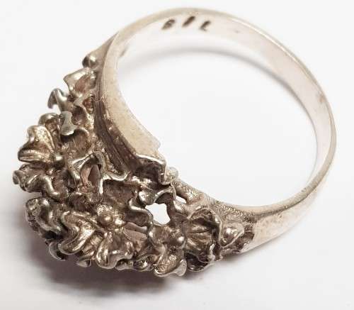 Three pretty stamped silver ladies rings