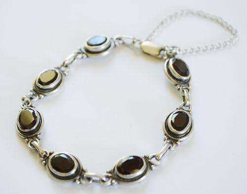 Beautiful silver bracelet with Garnet stones.