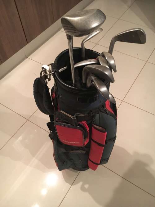 Golf bag plus clubs and wheels!!!