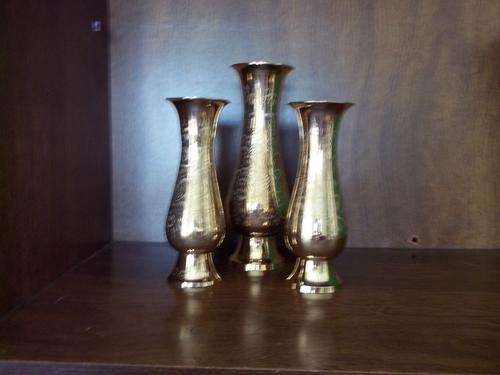 Three brass vases 2 x 20 cm high and 1 x 24.5 cm high