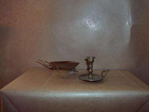 Miniture brass candlie holder and a Copper wheel barrow small