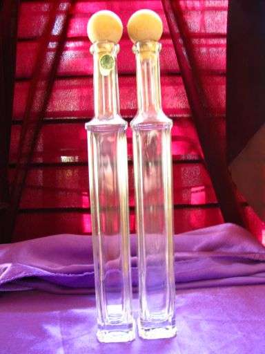 2 LOVELY TALL GLASS BOTTLES