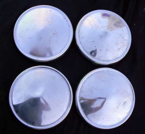 4 x Vintage Wheel caps -- (It looks like it is Plymouth caps but we are not 100% sure)