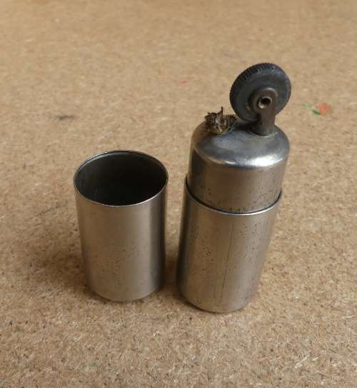 WW2 GERMAN Aluminum Wehrmacht trench lighter with Eagle and Swastika emblem.