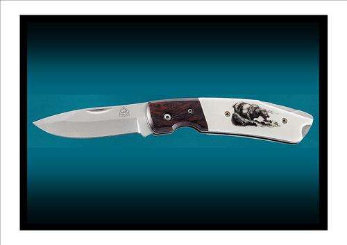 PUMA TEC: " Pakkawood, Scrimshaw look, BEAR". Very popular knife, highly in demand!.