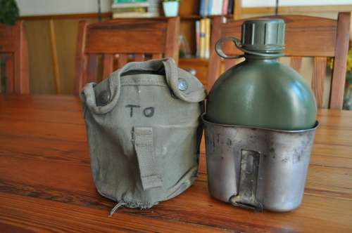 Old Army Water Bottle And Fire Bucket