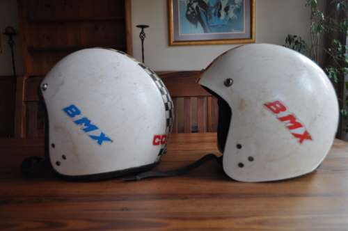 Vintage bicycle safety helmets with BMX stickers