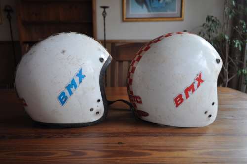 Vintage bicycle safety helmets with BMX stickers