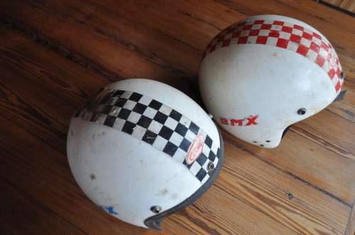 Vintage bicycle safety helmets with BMX stickers